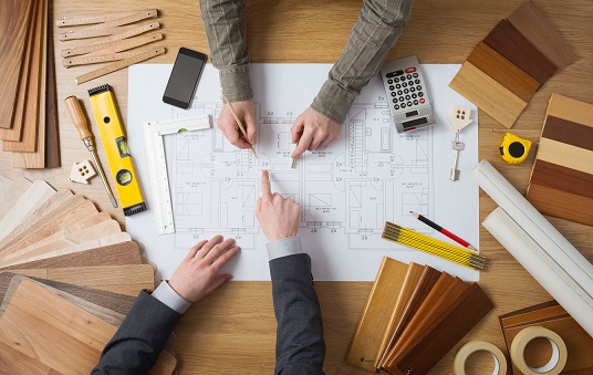 Customer businessman and construction engineer working together on a building project, desktop top view  remodelling preparation